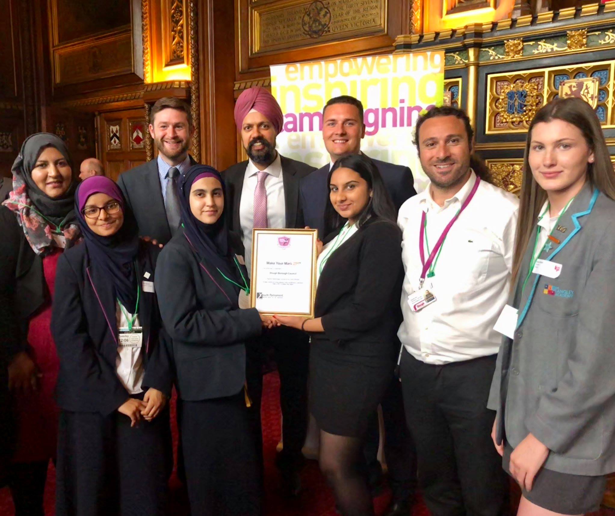 Members of Slough Youth Parliament receive their award for the Make Your Mark campaign