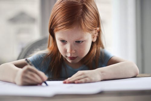 Girl writing paper